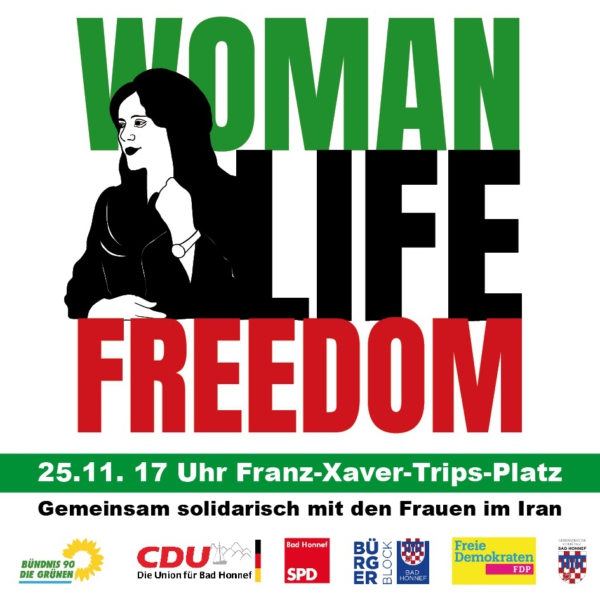 In grün, schwarz und roten Farben: Woman, Life, Freedom. Symbolbild einer Frau.